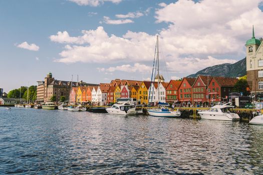 Bergen, Norway. View of historical buildings in Bryggen. Hanseatic wharf in Bergen, Norway July 28, 2019. UNESCO. Famous Bryggen street with wooden colored houses in Bergen Akerbrygge distric.