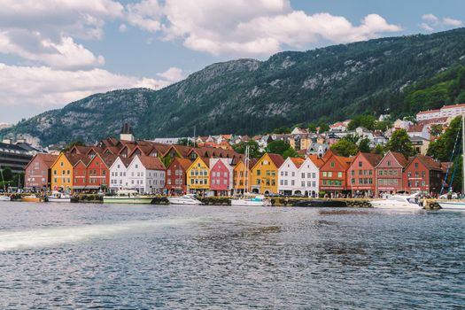 Bergen, Norway. View of historical buildings in Bryggen. Hanseatic wharf in Bergen, Norway July 28, 2019. UNESCO. Famous Bryggen street with wooden colored houses in Bergen Akerbrygge distric.