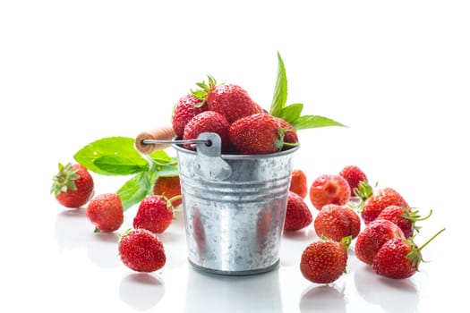 harvest of red ripe natural strawberries isolated on white background