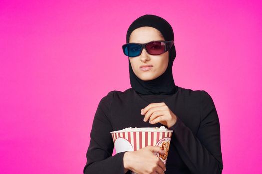 cheerful woman in 3D glasses popcorn entertainment movies studio lifestyle. High quality photo