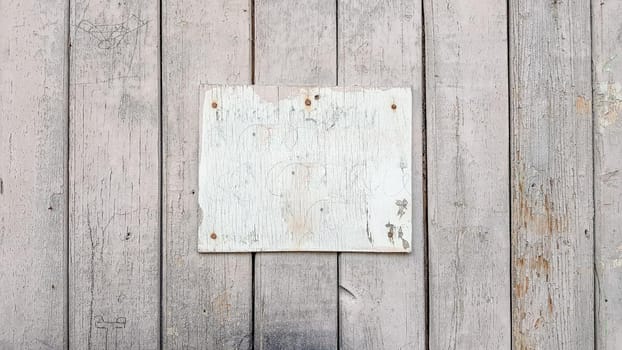 Sign boards on a rustic wooden wall mockup. vintage frames on an old wooden wall. Gray wooden background texture with copy space. wall wood table