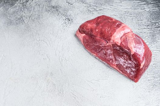 Raw lamb meat leg steak. White background. Top view. Copy space.