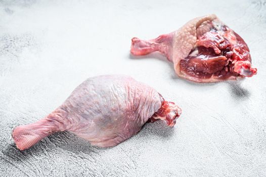 Free range raw Duck legs. White background. Top view.