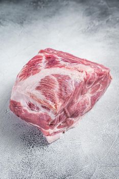 Raw pork neck meat for Chop steak on kichen table. White background. Top view.