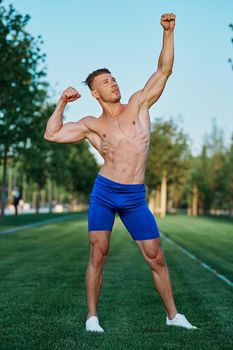 man doing exercises in the park inflated body. High quality photo