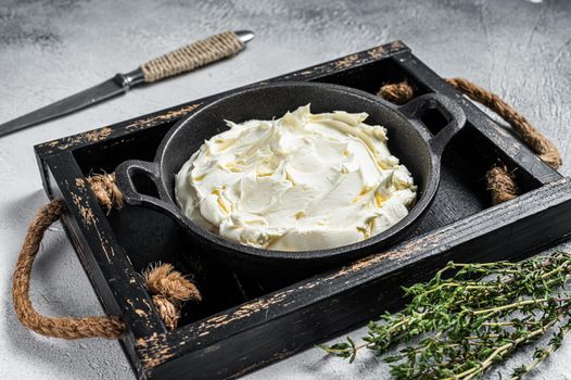 Cream cheese Mascarpone in a wooden tray for tiramisu. White background. Top view.