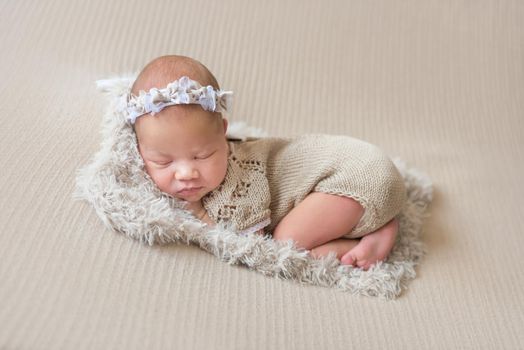 Cute sleeping newborn baby girl