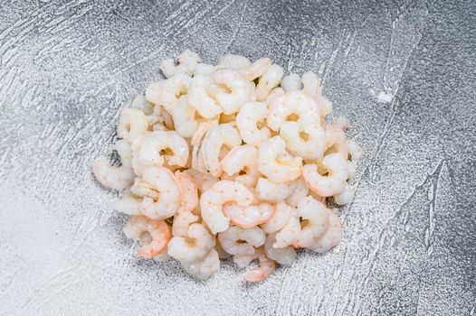 Peeled raw Shrimps, Prawns on a table. White background. top view.