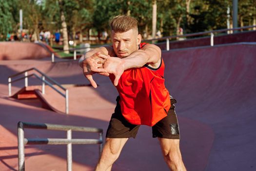 sports man on the playground in the park workout. High quality photo