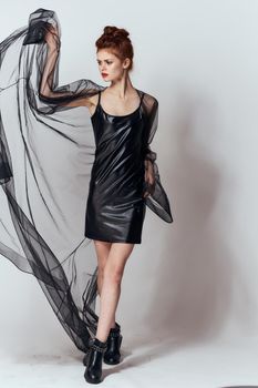 woman in black dress posing fashion glamor studio. High quality photo