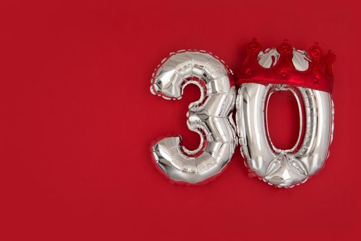 Silver Number Balloons 30 thirty in crown on dark red background. Holiday Party Decoration, 30 postcard concept with top view