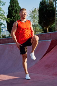 sports man on the playground in the park workout. High quality photo