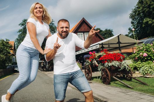 Portrait of a happy couple laughing at the camera in Nida.Happy people.Family.Lithuania.