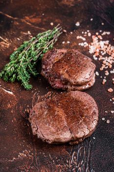Grilled Fillet Mignon tenderloin meat beef steaks. Dark background. Top view.