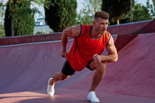 man doing exercises outdoors in the park. High quality photo