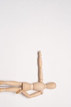 wooden mannequin toy object posing design light background. High quality photo