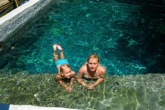 A happy family takes in a hydrogen sulfide treatment pool at a resort in Turkey.