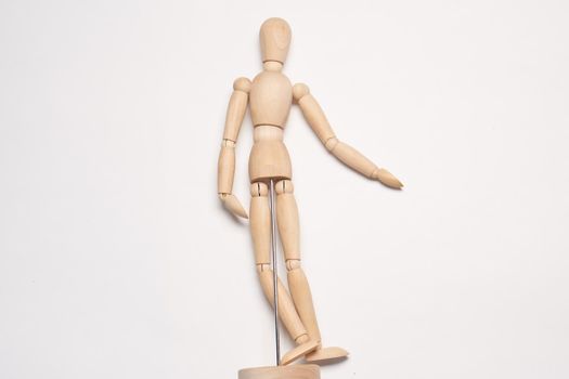 wooden mannequin object close up light background. High quality photo