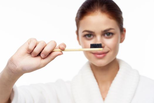 cheerful woman in white coat toothbrush dental health hygiene. High quality photo