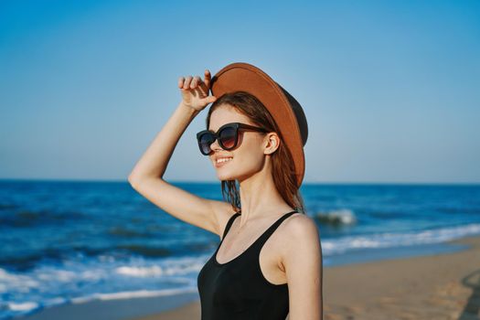 pretty woman on the beach summer vacation lifestyle sun. High quality photo