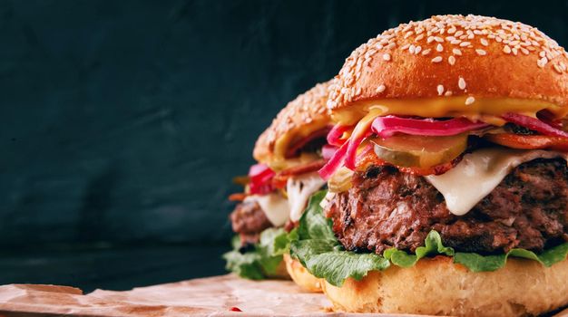 a delicious and juicy burger home in a rustic style with a big chop of beef