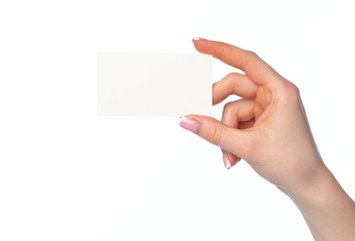 Beautiful female hand holding white business card isolated on white background