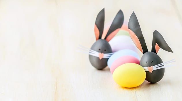 Cute creative photo with easter eggs, some eggs as the Easter Bunny