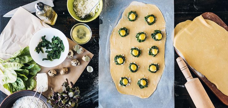 Step by step the chef prepares ravioli with ricotta cheese, yolks quail eggs and spinach with spices. The chef prepares the filling on the dough