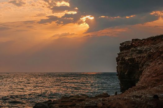 Beautiful view on a Black sea coast with mountains and sunset sky.