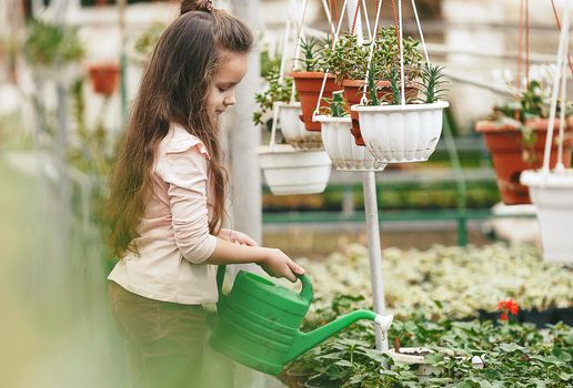 mother and daughter taking care of plants