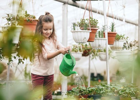 mother and daughter taking care of plants