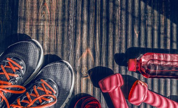 Sneakers dumbbells and a bottle of water. Flat view. All in one color.