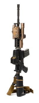 Military toy airsoft rifle isolated on white background. Close up.