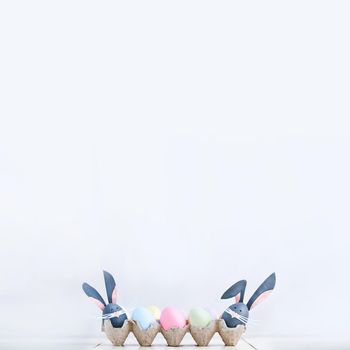 Cute creative photo with easter eggs, some eggs as the Easter Bunny