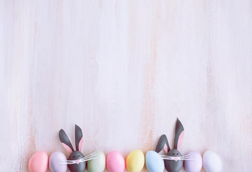 Cute creative photo with easter eggs, some eggs as the Easter Bunny