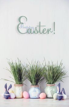 Cute creative photo with easter eggs, some eggs as the Easter Bunny