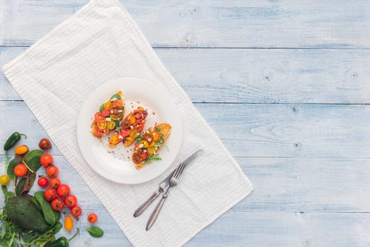 Bruschetta with cheese, basil, arugula and cherry tomatoes