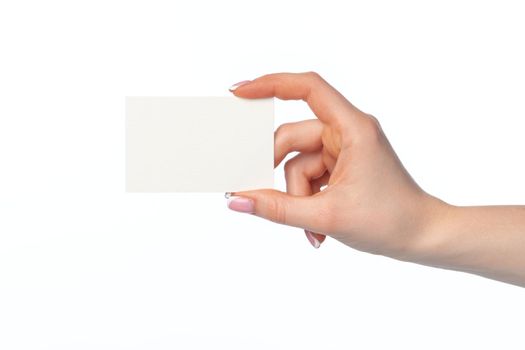 Female hand with blank white business card isolated on white background