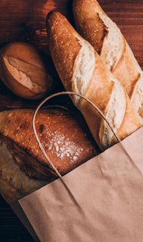 fresh bread in a paper bag. small bakery concept with gluten free flavored bread