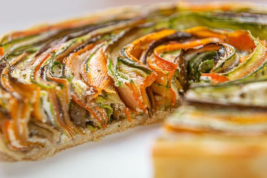 classic ratatouille pie on a light gray table.