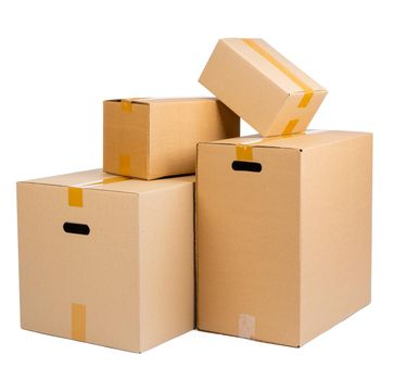 Stack of cardboard boxes isolated on white background. Close up.