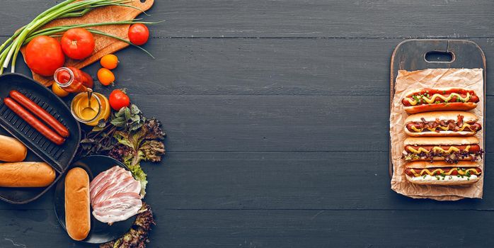 Barbecue Grilled Hot Dogs with  yellow American mustard, On a dark wooden background