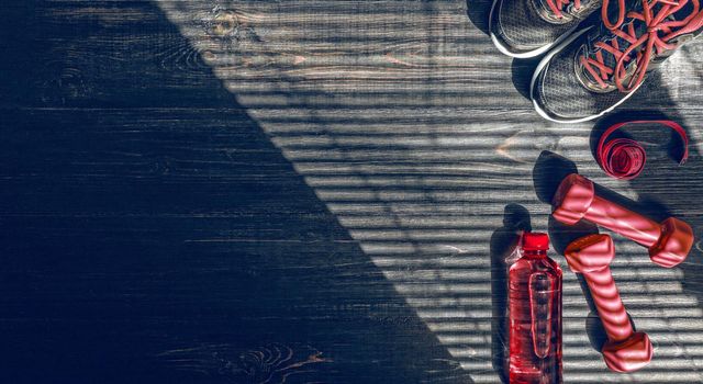 Sneakers dumbbells and a bottle of water. Flat view. All in one color.