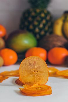 Dried homemade healthy fresh dehydrated slices of fruits. Fruit chips, natural raw vegan organic snack. Healthy food concept.