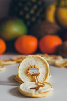 Dried homemade healthy fresh dehydrated slices of fruits. Fruit chips, natural raw vegan organic snack. Healthy food concept.