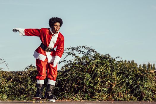 Happy african santa claus skateboarding