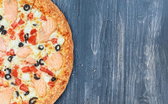 pizza close-up on a wooden surface