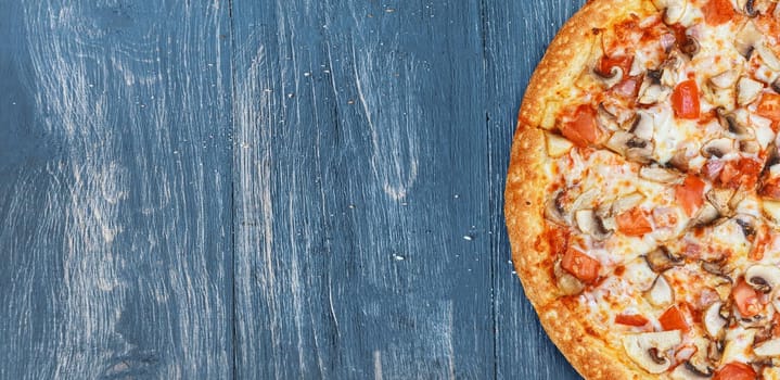 pizza close-up on a wooden surface