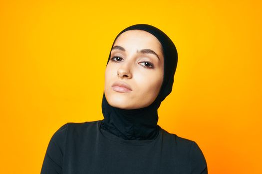 arab woman fun ethnicity model posing emotions yellow background. High quality photo