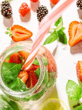 detox smoothies of fresh fruits and vegetables in glass jars with tubes. studio light, light background, space for text